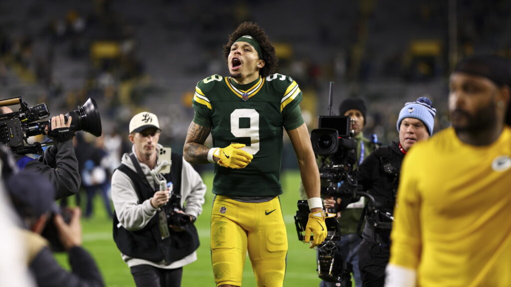 Christian Watson spat up blood, broke a rib, went to