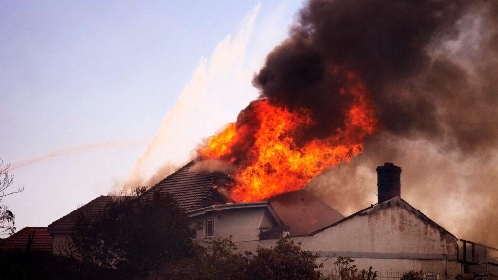 Coastal homes burn as hot winds fuel California fires : NPR Coastal homes burn as hot winds fuel California fires :